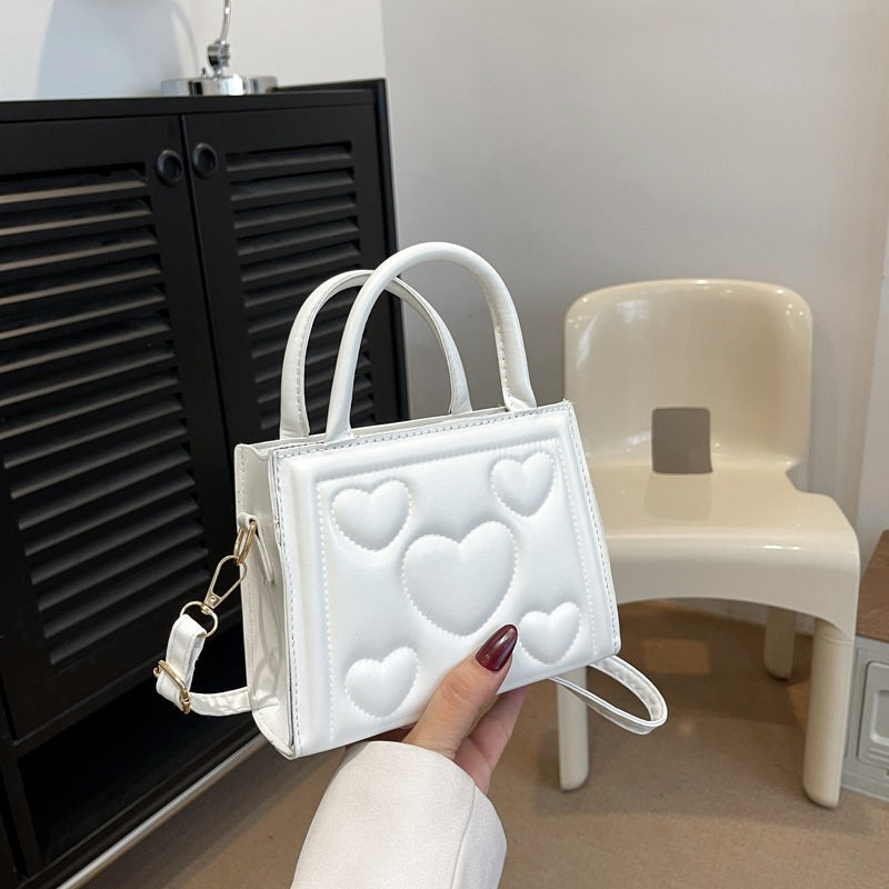 1pc Women’s Stylish Solid Color Handbag with Detachable Strap – Heart Pattern Design, Perfect for Valentine’s Day Gift, Available in Magenta, White, Black, Green, Yellow